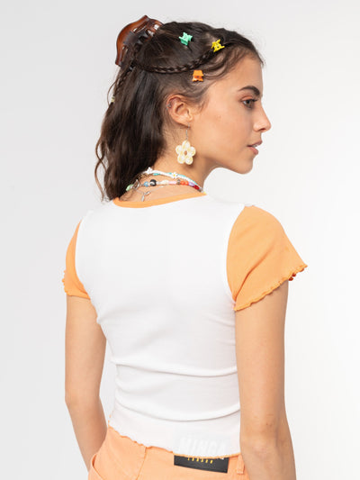Crop ribbed top in white with contrast sleeves in orange