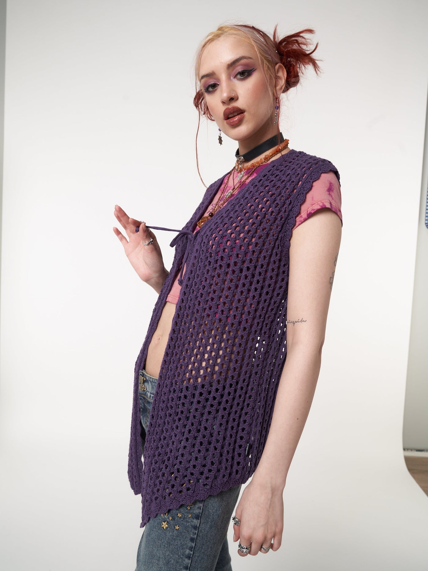 Tie front vest cardigan in purple featuring crochet style knit pattern