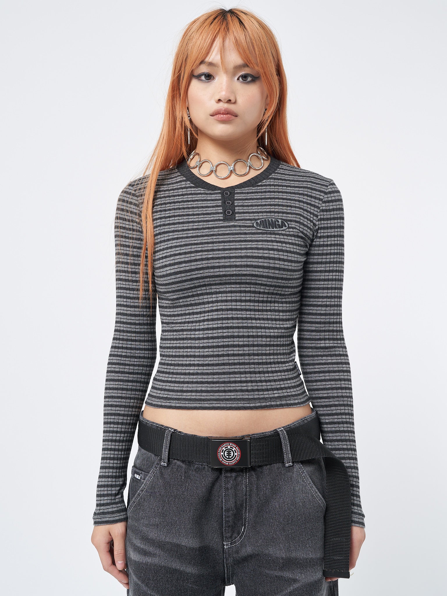 Long sleeve ribbed top with half button placket and al over stripes in grey and black